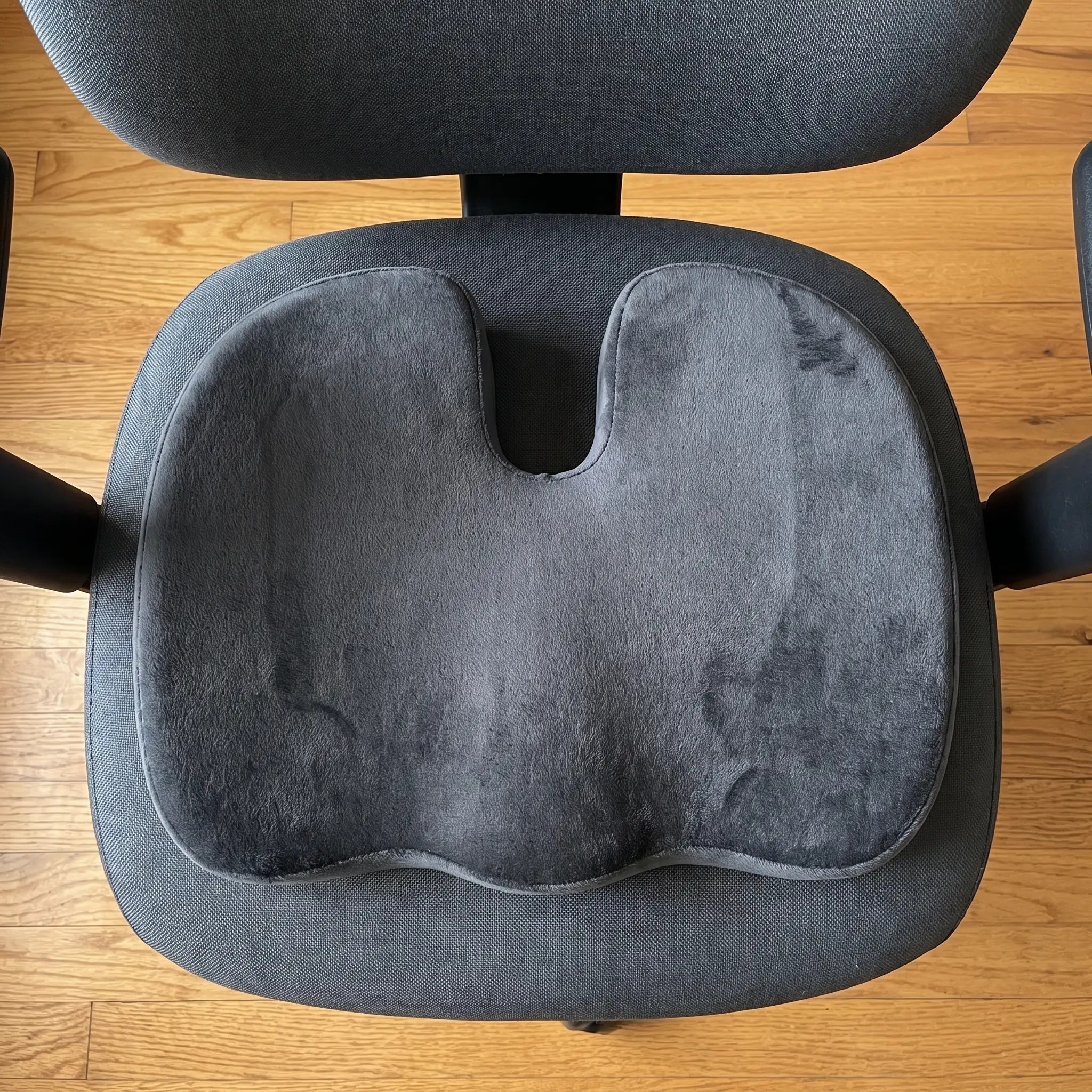 Top-down view showing how much of an office chair seat the cushion covers
